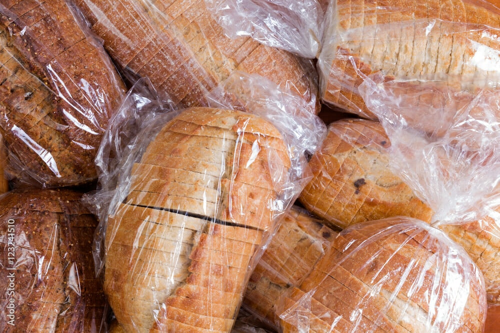A bunch of bread wrapped in plastic.