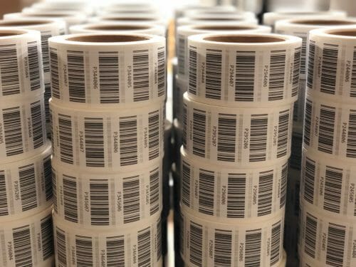 A roll of barcode labels stacked on top of each other.